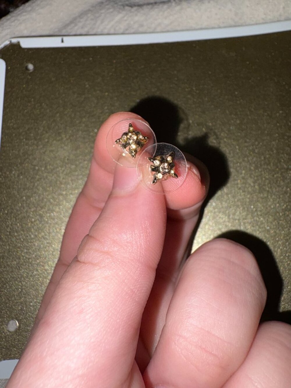 Gold stud earrings with backings included